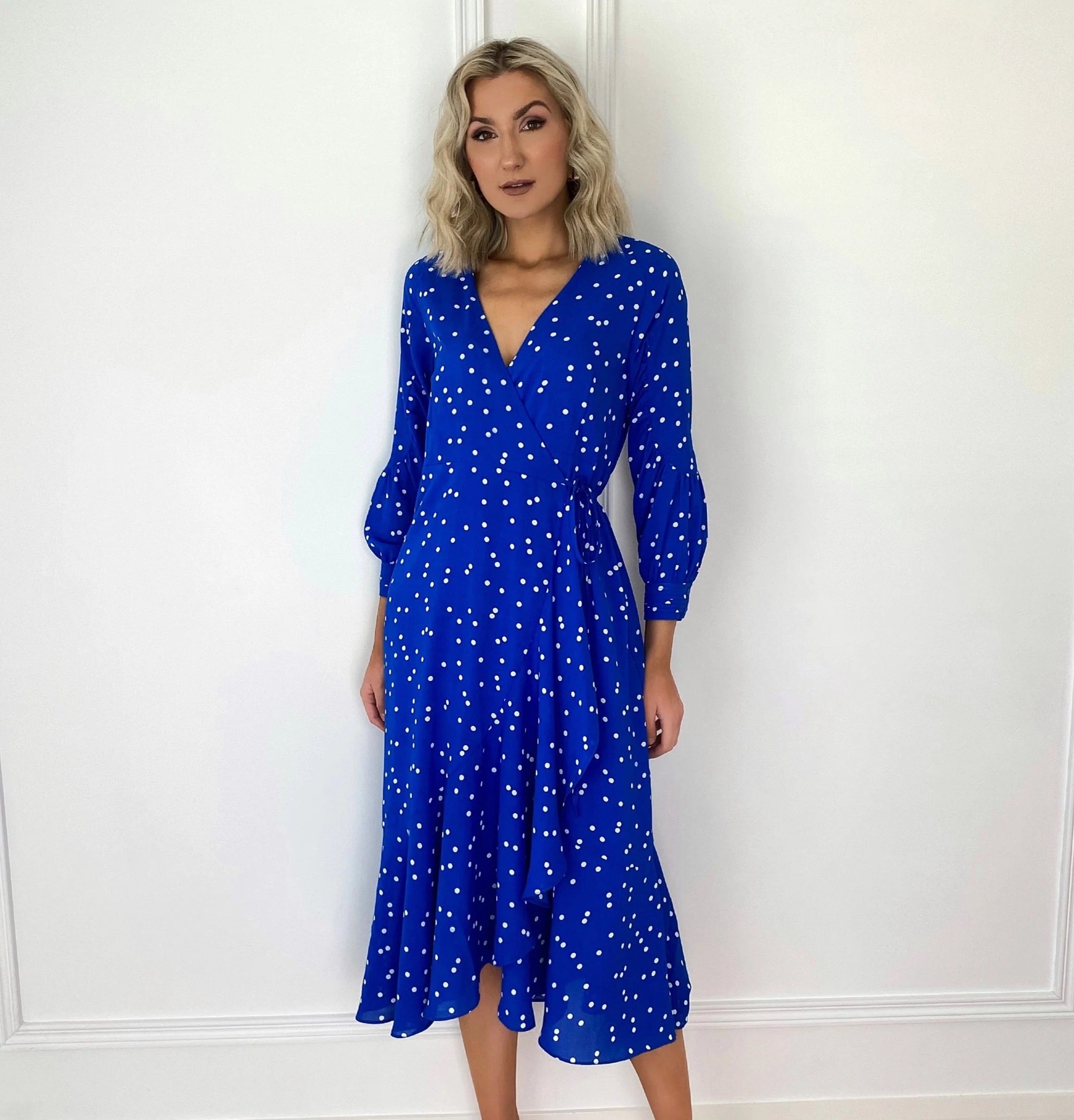 Midi dresses with asymmetric hems for a fashion - forward and dynamic appearance Emer Cobalt Blue Polka Dot Wrap Frill Hem Dress Midi dresses with asymmetric hems for a fashion - forward and dynamic appearance Emer Cobalt Blue Polka Dot Wrap Frill Hem Dress