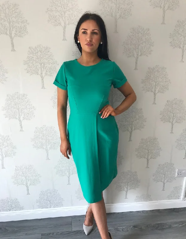 Midi dresses with tassel accents for a bohemian and free - spirited style Shannon Green Asymmetric Hem Wrap Skirt Dress Midi dresses with tassel accents for a bohemian and free - spirited style Shannon Green Asymmetric Hem Wrap Skirt Dress