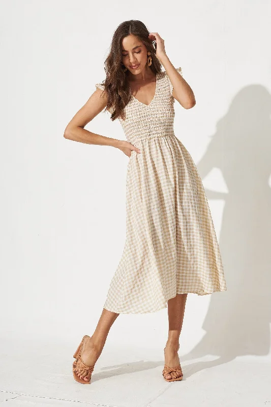 Midi dresses with fringe details for a fun and energetic styleJeannie Midi Dress In Beige Gingham Midi dresses with fringe details for a fun and energetic styleJeannie Midi Dress In Beige Gingham