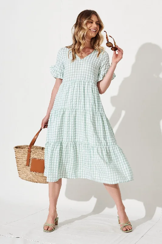 Midi dresses with pom - pom trims for a playful and festive lookKristen Midi Smock Dress In Mint Gingham Midi dresses with pom - pom trims for a playful and festive lookKristen Midi Smock Dress In Mint Gingham